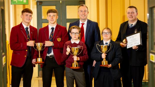 Education Minister Paul Givan pictured with pupils from Belfast Boys’ Model School, Knockevin Special School and St Columba’s Primary school at the Derrytrasna Awards ceremony at Stormont.