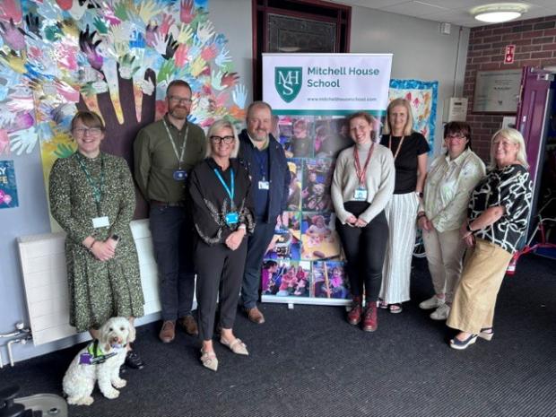 Working group members with Mitchell House School Principal, Miriam Donnan, and Raia, the school therapy dog (June 2026)